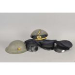 Collection of visor caps and a Belgian helmet