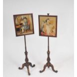 A pair of 19th century mahogany pole screens, each accommodating framed embroidered panels, one