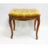A French upholstered piano stool, with carved foliate borders, 48cm high, 40 x 50cm.