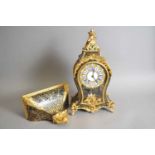 A French Louis XV style boulle marquetry mantel clock and associated bracket