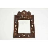 A late 19th century Italian renaissance style wall mirror with an arched cresting, inlaid with mop