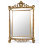 A large 19th century stepped gilt framed wall mirror,