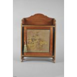 A small Edwardian mahogany hall cabinet with a Japanese lacquer panelled door