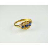 An 18ct gold untested sapphire and blue garnet topped doublet ring