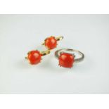 A coral and diamond ring and a pair of coral earrings