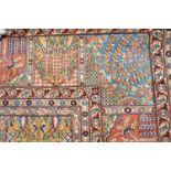 A large Kashmir woven rug