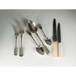 A matched set of Fiddle pattern silver flatware