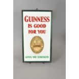 An original 20th century glazed enamel pub sign advertising Guinness