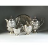 A Burmese white metal four piece coffee service