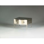 An Edwardian silver jewellery box in the form of a chest of drawers