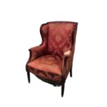 A 19th century French upholstered rosewood framed armchair,