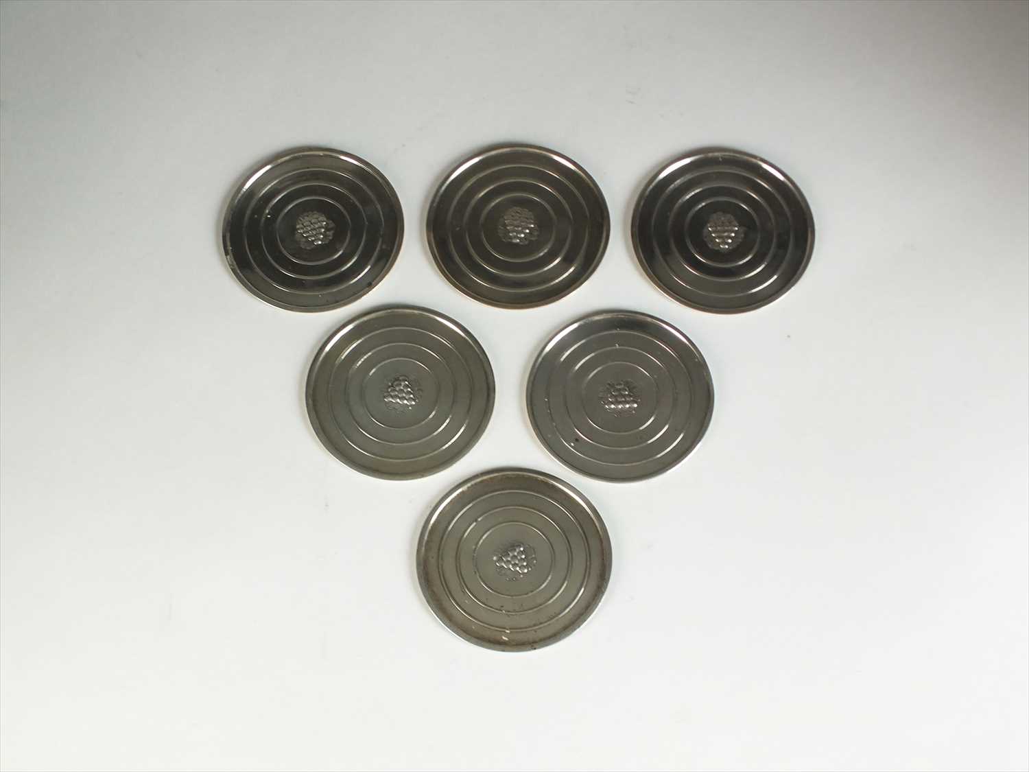 A set of four Georg Jensen small silver coasters