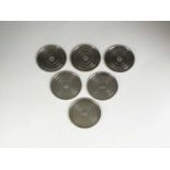 A set of four Georg Jensen small silver coasters