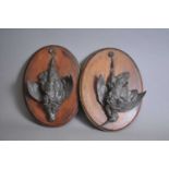 A pair of 19th century cast bronze studies of hanging dead game