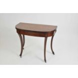 An early 19th century Dutch marquetry tea table, the rounded rectangular top, decorated with
