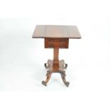 A small Regency rosewood writing table