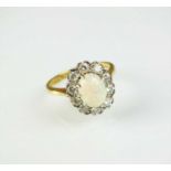 An 18ct gold opal and diamond cluster ring