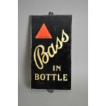 An original slate-backed glass pub advertising sign for 'Bass In Bottle' by Dickson, London
