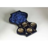 A cased set of four Victorian shell salts and spoons