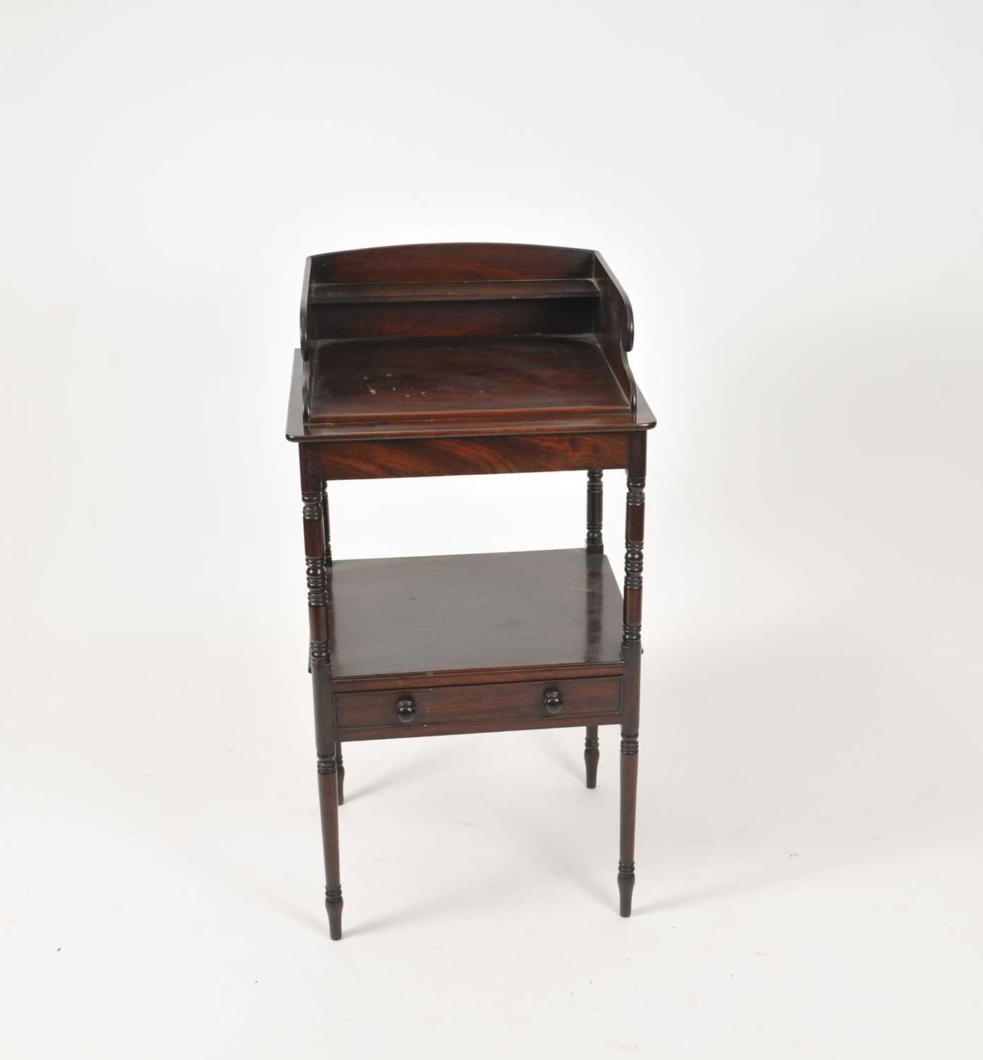 A Regency mahogany washstand with turned supports and an undertier with a frieze drawer, 50.5 x 45.5