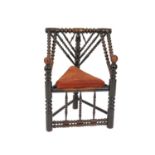 A 19th century turners chair, of good colour, the 'V' shaped back with a central acorn finial, the