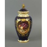 A Coalport vase and cover decorated with fruit