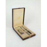 A commemorative Dunhill cased lighter, fountain pen and biro set