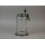 An 18th century glass and pewter-mounted tankard