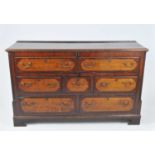 An 18th century oak and mahogany crossbanded Lancashire mule chest, the ovolo lip-moulded drawers