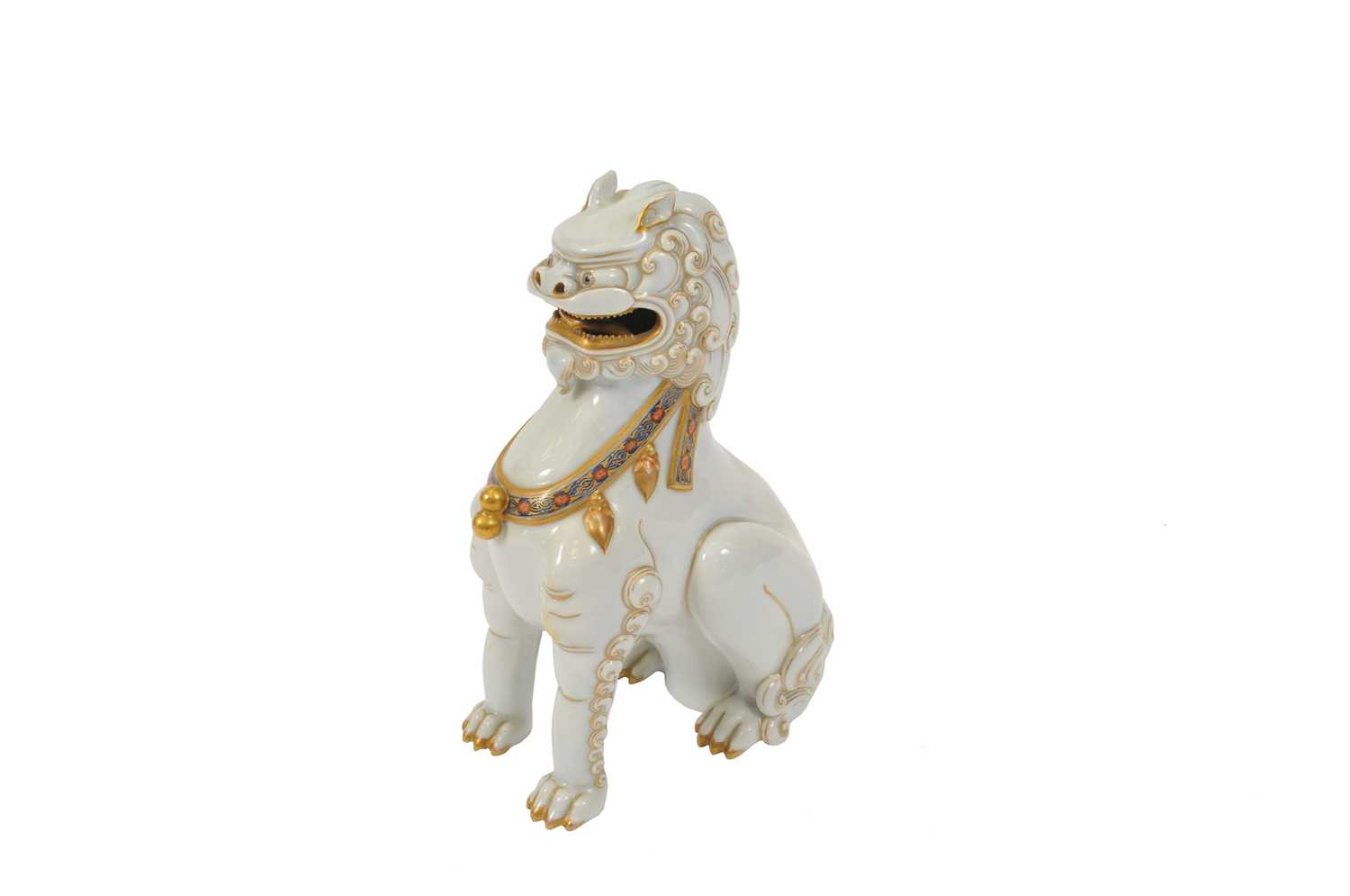 A 19th century Japanese porcelain temple dog, or shishi, on base incised and gilded marks, 23cm