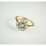 A diamond floral cluster ring