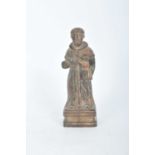 An 18th century carved figure of a saint, 27cm high Provenance: Property of a Titled Estate