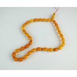 A uniform amber bead necklace