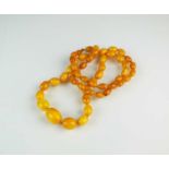 A graduated amber bead necklace