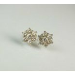 A pair of diamond floral cluster earrings