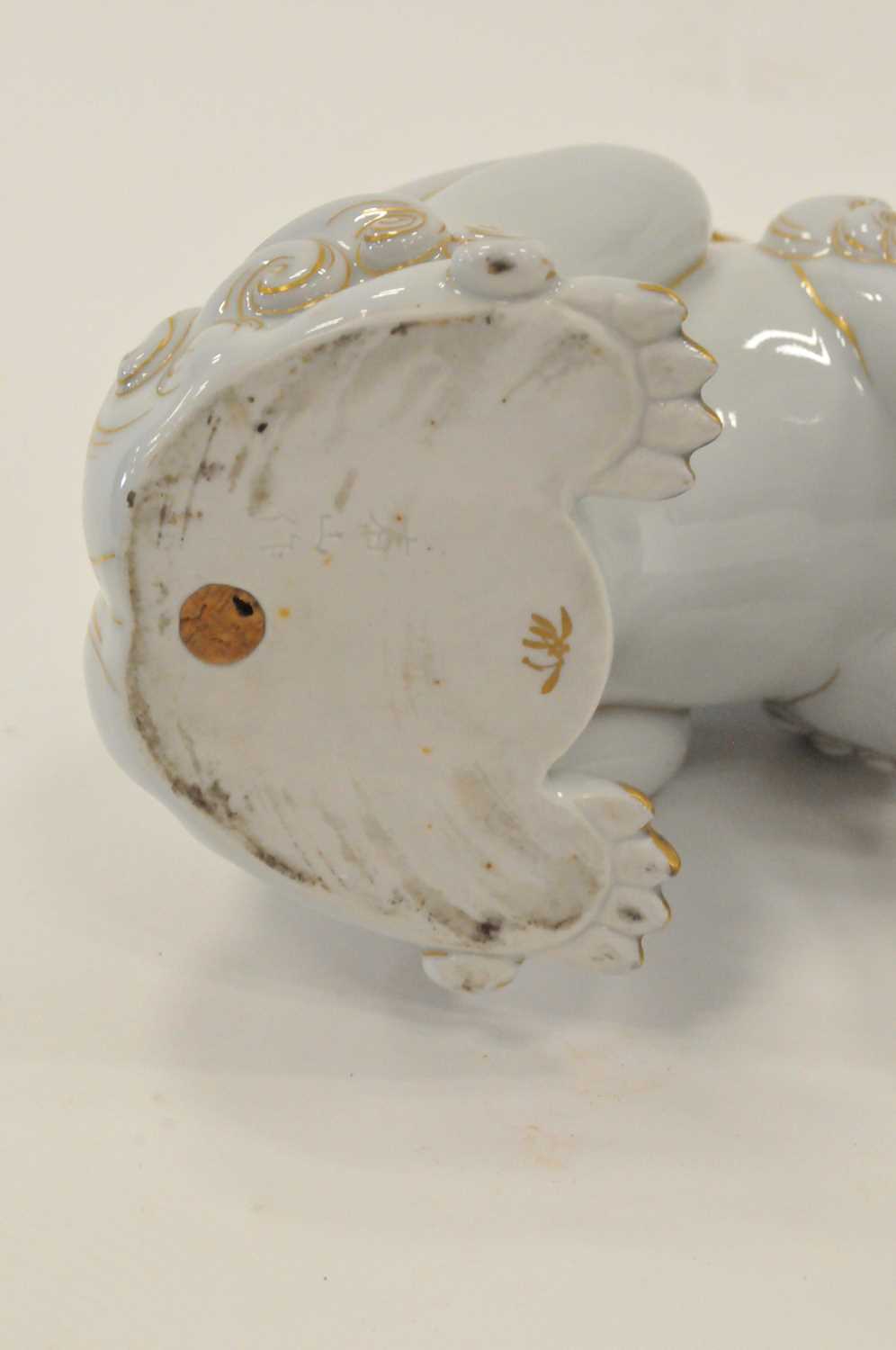 A 19th century Japanese porcelain temple dog, or shishi, on base incised and gilded marks, 23cm - Image 2 of 2