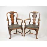 A pair of good, early 20 century, George I / II style stained walnut elbow chairs, the vase shaped