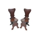 A pair of 18th / 19th century sgabella form mahogany hall chairs, 92.5cm high