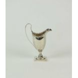 A George III silver cream jug by Hester Bateman