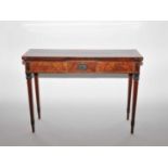 A George III mahogany and satinwood crossbanded serving table, the rectangular top inlaid with a