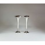 A pair of silver mounted posy vases