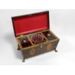 A Regency rosewood, sarcophagus form tea caddy, inlaid with satinwood banding and oval panels,