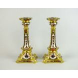 A pair of Royal Crown Derby imari candlesticks