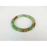 A carved jade bangle