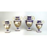 A garniture of four Bloor Derby twin-handled vases