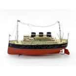 An early 20th century tinplate clockwork model of a 3-funnel steam ship, 41cm longCondition