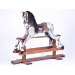 A large painted wood rocking horse