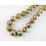 A gilt metal cloisonne bead necklace