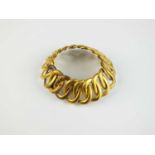 A yellow metal entwined oval link bracelet