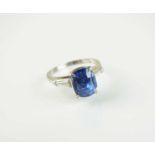 A three stone sapphire and diamond ring